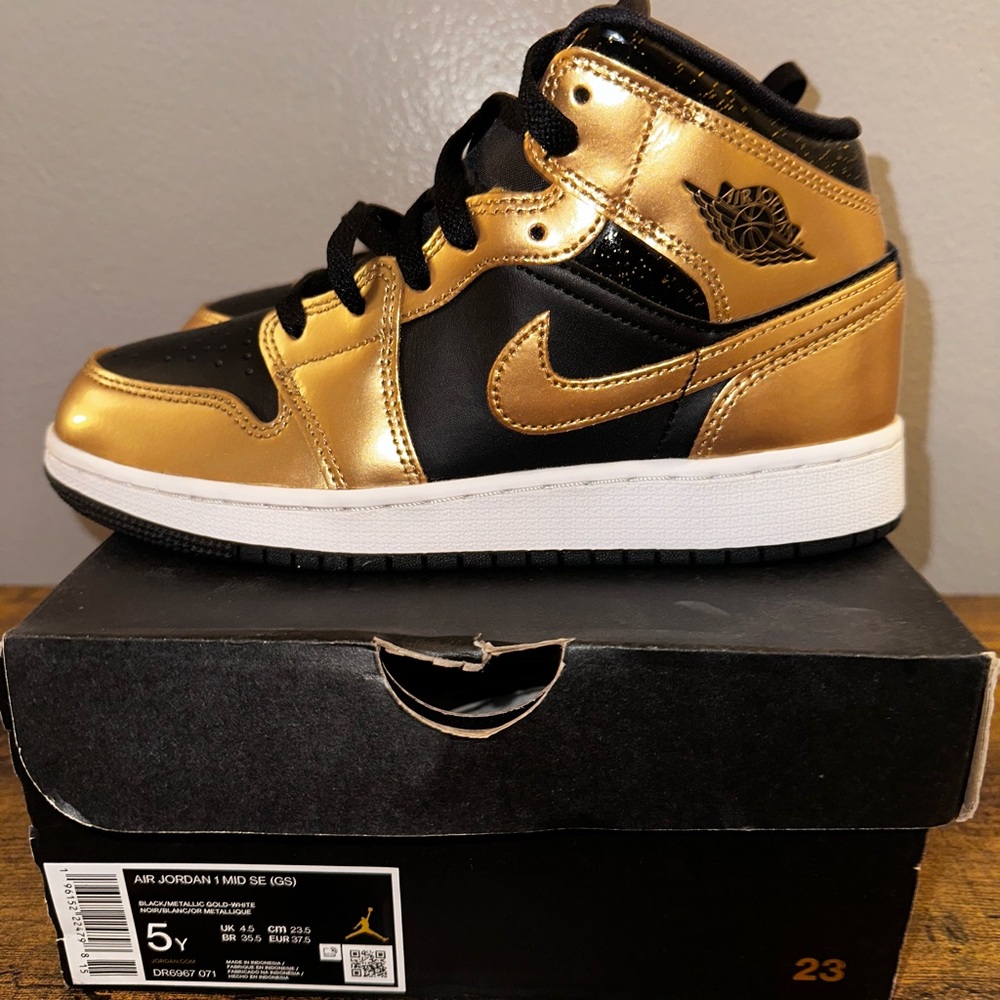 Air Jordan 1 Mid SE Black and Gold Sneakers
